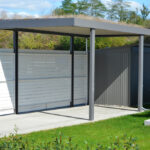 New,Metal,Carport,With,Greened,Roof,In,Front,Of,A