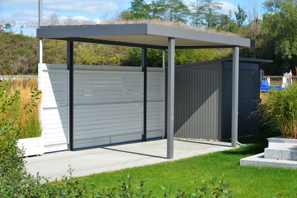 New,Metal,Carport,With,Greened,Roof,In,Front,Of,A