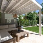 Backyard,Of,A,White,House,Located,In,The,Granada,Neighborhood