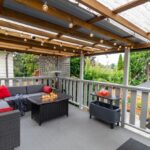 A,Back,Porch,Patio,Deck,With,Nice,Furniture,And,Red