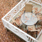 Patio,Furniture,Covered,With,Fall,Leaves,On,A,Back,Deck.